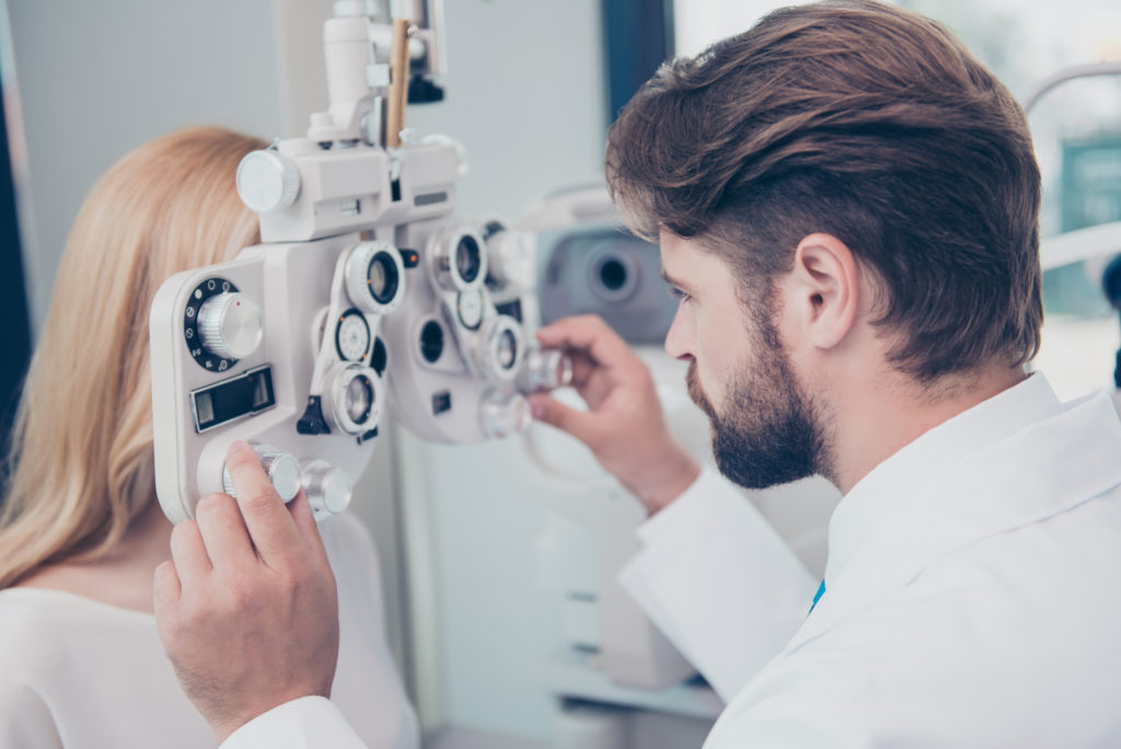 Optometrist explaining an eye test